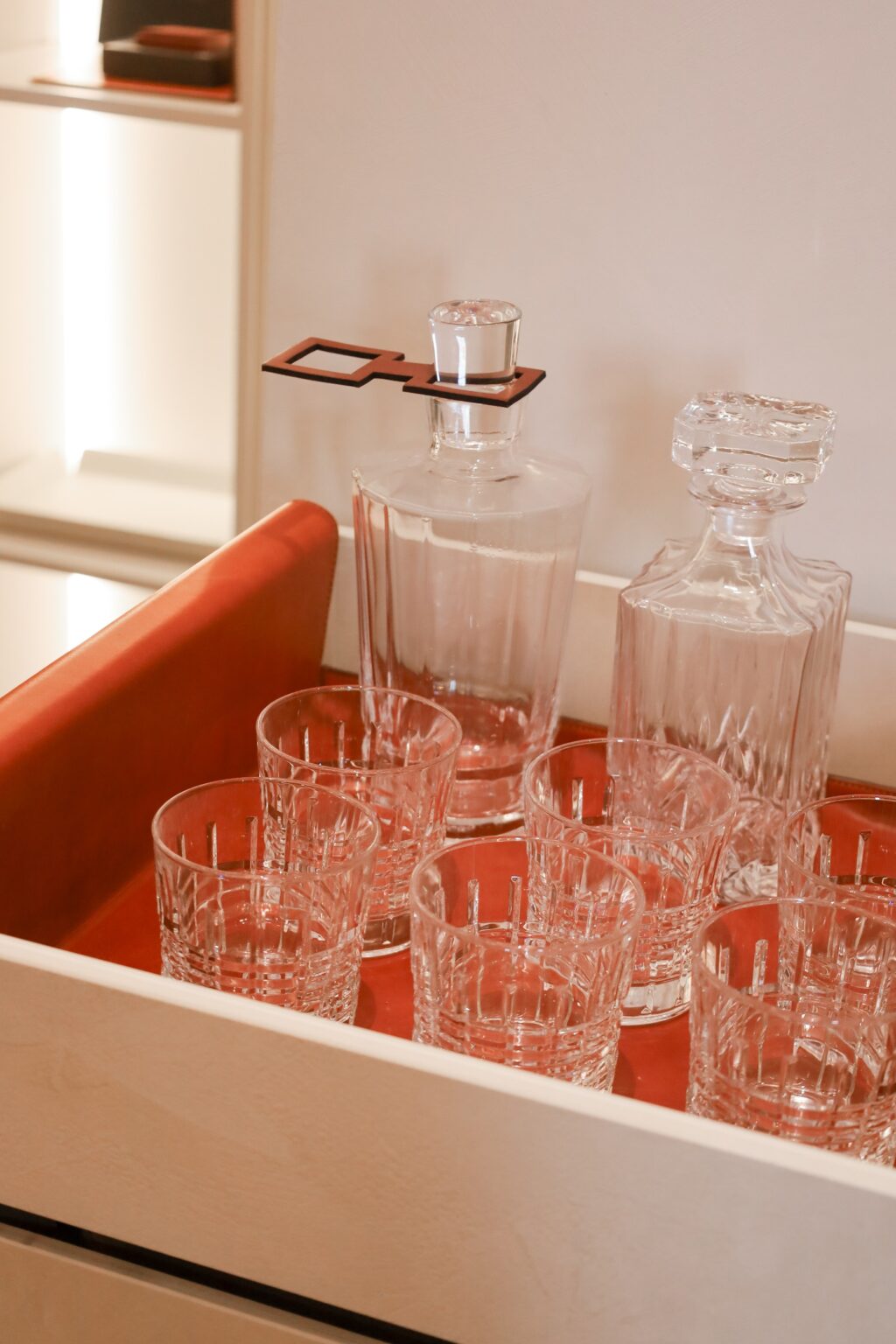 A drink cart with a background matching the color of the smart dog house